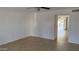 Bright living room with tile flooring, a ceiling fan and ample natural light creating a comfortable atmosphere at 4217 W Medlock Dr, Phoenix, AZ 85019