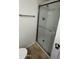 Bathroom features tile shower with glass door, updated fixtures, and a convenient towel rack at 4217 W Medlock Dr, Phoenix, AZ 85019