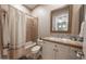 Well-lit bathroom with tiled shower/tub, white vanity with decorative backsplash and large mirror at 4636 E Carriage Ct, Gilbert, AZ 85297
