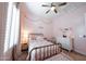 Pink bedroom with gold accents, soft carpet, and neutral decor at 4636 E Carriage Ct, Gilbert, AZ 85297