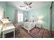 Charming bedroom with a ceiling fan, white furniture, and a soft pastel color scheme creating a relaxing atmosphere at 4636 E Carriage Ct, Gilbert, AZ 85297