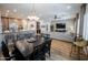 Open-concept dining room and living room with hardwood floors and recessed lighting at 4636 E Carriage Ct, Gilbert, AZ 85297