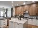 Well-lit kitchen with white cabinets, stainless steel appliances, and modern countertops at 4636 E Carriage Ct, Gilbert, AZ 85297