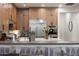 View of the kitchen, featuring a stainless steel refrigerator, island, and stylish cabinets at 4636 E Carriage Ct, Gilbert, AZ 85297