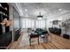 Bright living room with hardwood floors, fireplace, recessed lights, and decorative ceiling at 4636 E Carriage Ct, Gilbert, AZ 85297