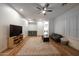 Large living room with wood floors, ceiling fan, and neutral decor at 4636 E Carriage Ct, Gilbert, AZ 85297