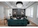 Cozy living room featuring a fireplace, built-in shelving, and hardwood flooring at 4636 E Carriage Ct, Gilbert, AZ 85297