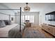Bright main bedroom with wood floors, shutters, and comfortable work space at 4636 E Carriage Ct, Gilbert, AZ 85297