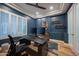 Contemporary home office with a large desk, sleek design, plantation shutters, and plenty of natural light at 4636 E Carriage Ct, Gilbert, AZ 85297