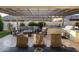 Backyard patio under a pergola with an outdoor kitchen, a grill, lounge seating, and a cozy fire pit at 4636 E Carriage Ct, Gilbert, AZ 85297