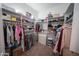 Walk-in closet with custom shelving and ample storage space at 4636 E Carriage Ct, Gilbert, AZ 85297