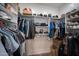 Walk-in closet with custom shelving and ample storage space at 4636 E Carriage Ct, Gilbert, AZ 85297