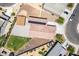 Aerial view of the home with desert landscaping, solar panels, and a grassy backyard with trampoline at 4654 W Suncup Dr, San Tan Valley, AZ 85144