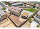 Birds eye view of the backyard with green lawn and a patio area with gravel and pavers at 4654 W Suncup Dr, San Tan Valley, AZ 85144