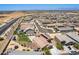 Aerial view of a planned residential neighborhood with multiple single Gathering homes and backyards with a trampoline at 4654 W Suncup Dr, San Tan Valley, AZ 85144