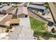 An aerial view of the backyard with a trampoline and a swing set and nearby homes at 4654 W Suncup Dr, San Tan Valley, AZ 85144