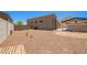 The spacious yard has rock landscaping and mature landscaping, plus a covered parking area at 4654 W Suncup Dr, San Tan Valley, AZ 85144