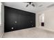Spacious bedroom with dark accent wall and ceiling fan at 4654 W Suncup Dr, San Tan Valley, AZ 85144
