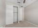 Cozy bedroom featuring a closet with sliding doors and neutral carpeting at 4654 W Suncup Dr, San Tan Valley, AZ 85144
