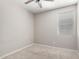 Bright bedroom with carpet, ceiling fan, and window with blinds at 4654 W Suncup Dr, San Tan Valley, AZ 85144