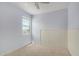 A light blue bedroom with a carpeted floor and a window at 4654 W Suncup Dr, San Tan Valley, AZ 85144