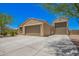 Beautiful single-story home with desert landscaping and two car garage at 4654 W Suncup Dr, San Tan Valley, AZ 85144