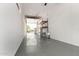 A bright garage with open doors and gray epoxy flooring at 4654 W Suncup Dr, San Tan Valley, AZ 85144