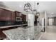 Modern kitchen with granite countertops, stainless steel appliances and island at 4654 W Suncup Dr, San Tan Valley, AZ 85144