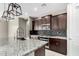 Modern kitchen with granite countertops, stainless steel appliances, and overhead lighting at 4654 W Suncup Dr, San Tan Valley, AZ 85144