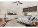 Cozy bedroom with a ceiling fan, artwork, and a comfortable bed, creating a serene and inviting atmosphere at 4909 N Woodmere Fairway -- # 1004, Scottsdale, AZ 85251