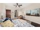 Spacious bedroom featuring a plush bed, seating area, and ensuite bathroom access, offering comfort and convenience at 4909 N Woodmere Fairway -- # 1004, Scottsdale, AZ 85251