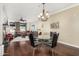 Inviting dining area open to a spacious living room with a comfortable sofa and large windows offering ample natural light at 4909 N Woodmere Fairway -- # 1004, Scottsdale, AZ 85251