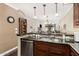 Open kitchen design with modern appliances, granite countertops, and a view into the living area, ideal for entertaining guests at 4909 N Woodmere Fairway -- # 1004, Scottsdale, AZ 85251