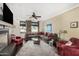 Comfortable living room with fireplace, neutral tones, large windows, and stylish decor at 4909 N Woodmere Fairway -- # 1004, Scottsdale, AZ 85251
