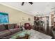 Spacious open-concept living room flows into kitchen featuring dark wood floors and comfortable seating at 4909 N Woodmere Fairway -- # 1004, Scottsdale, AZ 85251
