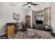 The office features hard wood floors, large windows, office supplies and a ceiling fan at 4909 N Woodmere Fairway -- # 1004, Scottsdale, AZ 85251