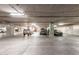 A well-lit parking garage provides secure and ample space for residents' vehicles in a controlled-access environment at 4909 N Woodmere Fairway -- # 1004, Scottsdale, AZ 85251