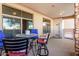Enjoy outdoor living on the covered patio with views, stylish furnishings, and convenient access to indoor spaces at 4909 N Woodmere Fairway -- # 1004, Scottsdale, AZ 85251