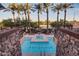 Beautiful swimming pool area with palm trees and jacuzzi; The Sage is printed at the bottom of the pool at 4909 N Woodmere Fairway -- # 1004, Scottsdale, AZ 85251