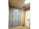 Carpeted bedroom with full wall-mounted storage at 530 S Alma School Rd # 75, Mesa, AZ 85210