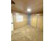 Carpeted bedroom featuring wall-mounted storage, closets and a window with polka dot curtains at 530 S Alma School Rd # 75, Mesa, AZ 85210