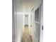 Bright hallway features clean white walls, tile flooring, and modern lighting at 530 S Alma School Rd # 75, Mesa, AZ 85210