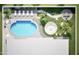 An aerial view of a backyard that features a pool, outdoor seating, and a fire pit at 5324 E Hillery Dr, Scottsdale, AZ 85254