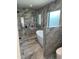 Luxurious bathroom with a marble-tiled shower, soaking tub, and modern fixtures at 5324 E Hillery Dr, Scottsdale, AZ 85254