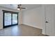 Bedroom with sliding doors to backyard patio and pool at 5324 E Hillery Dr, Scottsdale, AZ 85254