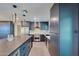 Kitchen features include sleek cabinets, stainless steel appliances, and modern lighting at 5324 E Hillery Dr, Scottsdale, AZ 85254