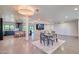 Open concept living room with modern kitchen, dining area, and natural light at 5324 E Hillery Dr, Scottsdale, AZ 85254
