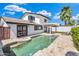 Backyard featuring a pool, patio, artificial grass, and mountain view at 5435 E Cambridge Ave, Phoenix, AZ 85008