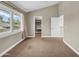 Spacious bedroom with large window, closet, and neutral paint ready for your personal touch at 5435 E Cambridge Ave, Phoenix, AZ 85008