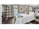 Comfortable bedroom features a queen-sized bed, a large window, and custom closet storage at 5435 E Cambridge Ave, Phoenix, AZ 85008